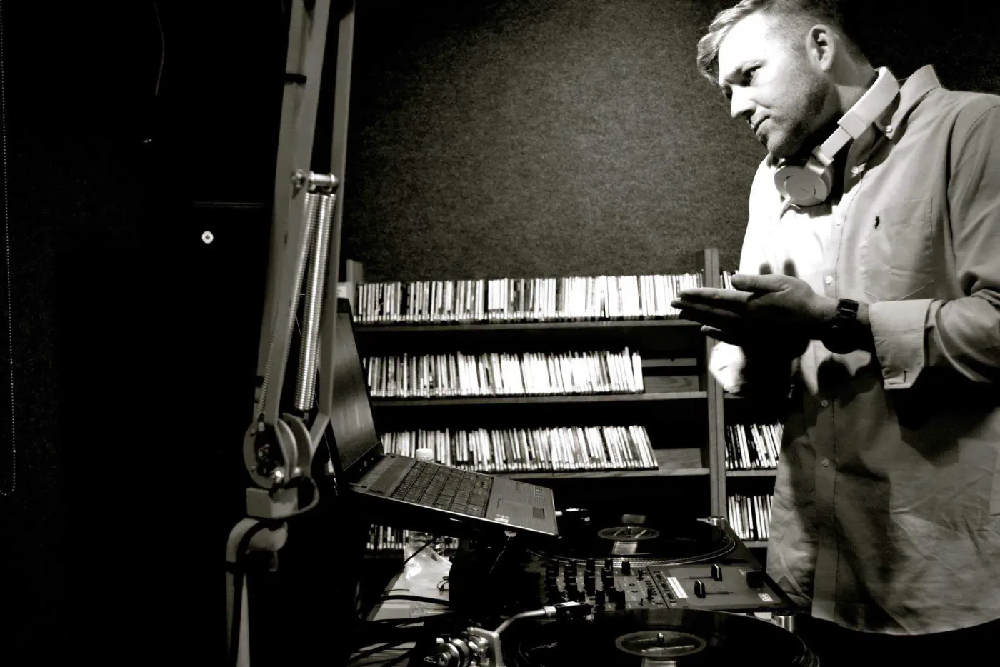 DJ Swann in the studio crate-digging